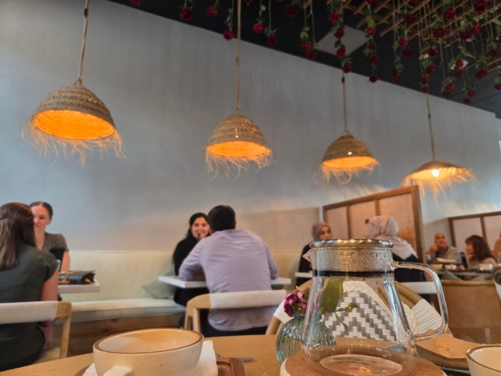 Cafe Lavende in Milton, Georgia, showing a casual interior with woven lights and patrons seated at tables, illustrating the everyday social atmosphere of a local café.