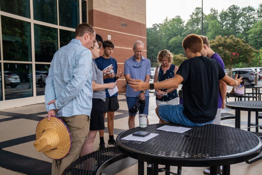 Perimeter Church members praying together outside the church campus in Johns Creek, Georgia