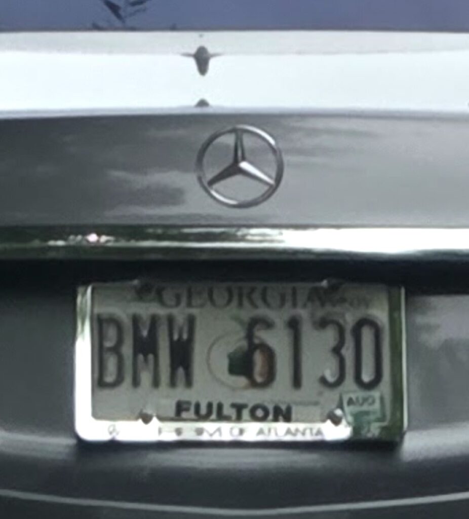 Even a closer look of a Mercedes with a standard Georgia license plate stopped near a Baptist church in Johns Creek, the plate number forming an ironically meaningful combination.