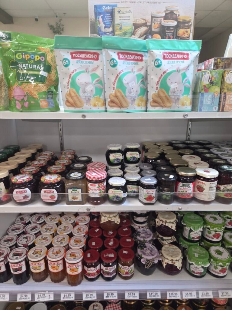 Shelves of imported fruit preserves, jams, baby cookies and specialty sweets at Golden Key European grocery in South Forsyth.