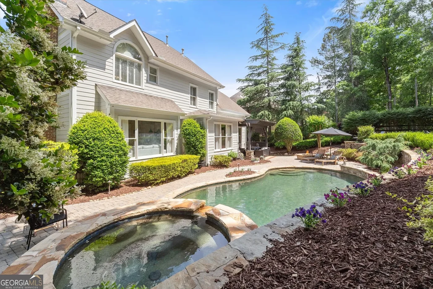 House of the Week: A Backyard Resort Hidden in Sugar Hill’s Wild Timber