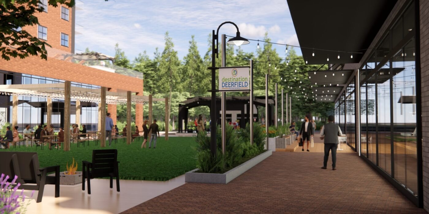 A pedestrian-friendly district would depend on the trails, sidewalks and public spaces Milton says must arrive alongside new development. A landscaped pedestrian promenade with seating, string lights and glass-fronted buildings.