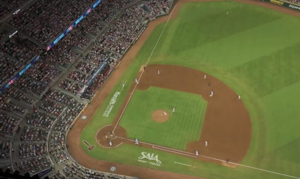 Aerial view of a baseball field at Truist Park with the infield and stands visible.