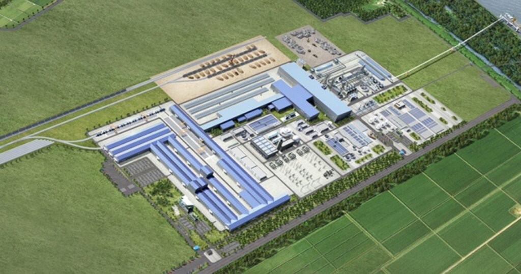 Aerial rendering of a large industrial complex with multiple blue-roofed buildings surrounded by green fields