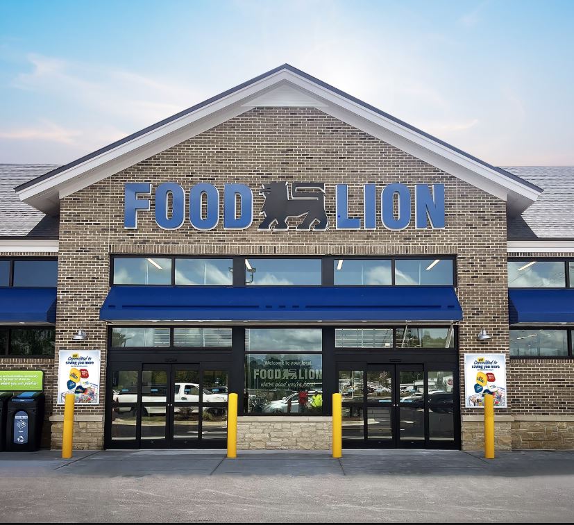 Food Lion storefront with brick facade, blue awning and glass entrance doors