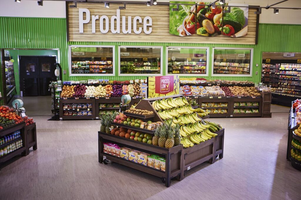 Produce department with bananas, apples and other fresh fruit displays