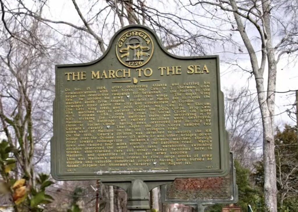 Historic marker sign reading 'The March to the Sea' among leafless trees