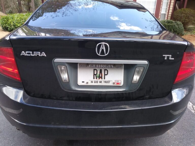 Rear of a black Acura TL with a Georgia vanity plate reading RAP.