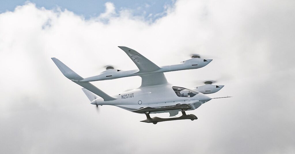 BETA Technologies A250 electric vertical takeoff and landing prototype in flight, photographed in 2024 by Brian Jenkins.