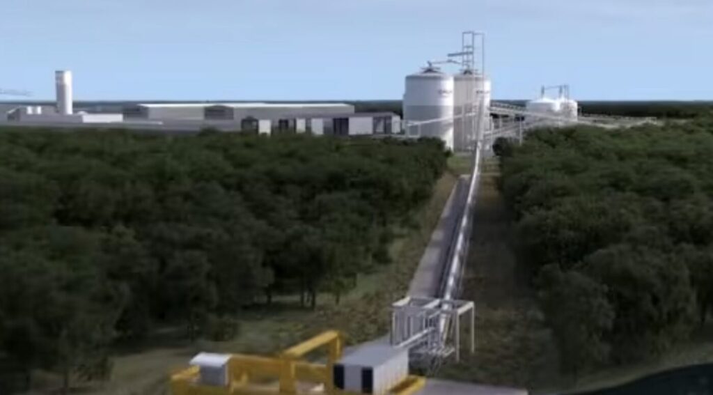 Rendering of an industrial facility with a long conveyor or elevated structure running through trees.
