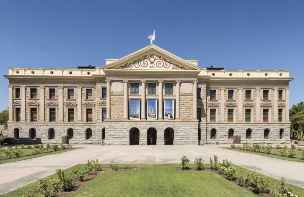 Arizona State Capitol building under a clear blue sky