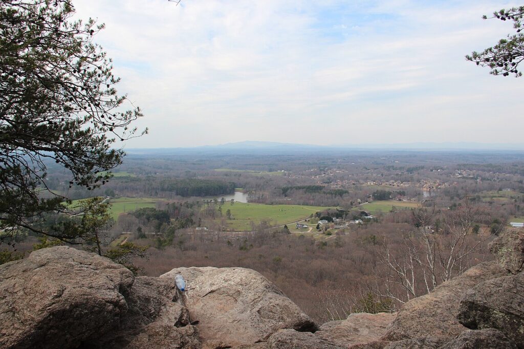 Distant mountains seen beyond bare trees from Indian Seats at Sawnee Mountain Preserve in March 2017.