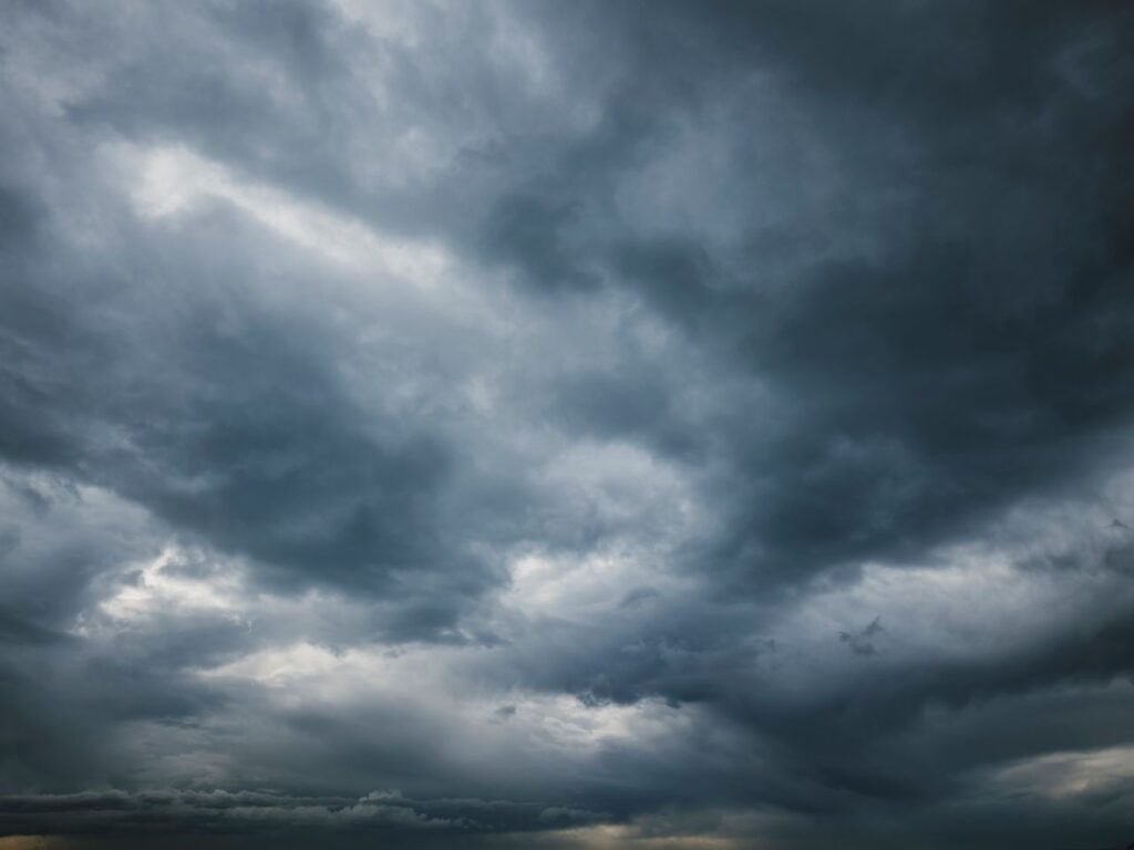 Dark storm clouds fill the sky.