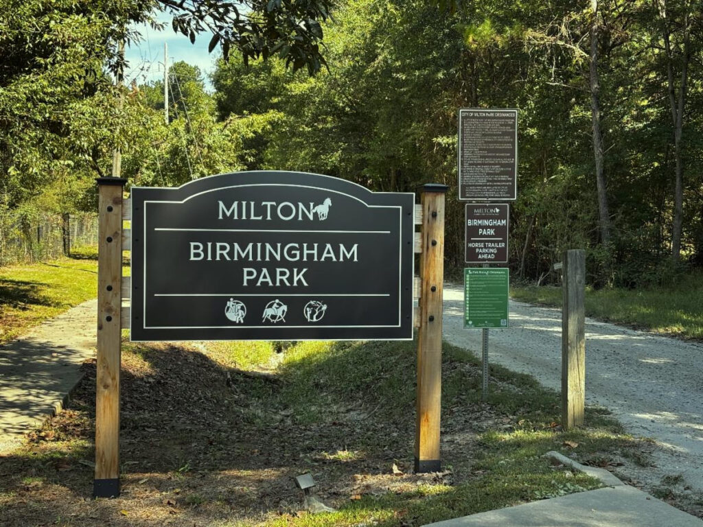 A roadside sign marking the entrance to Birmingham Park in Milton.